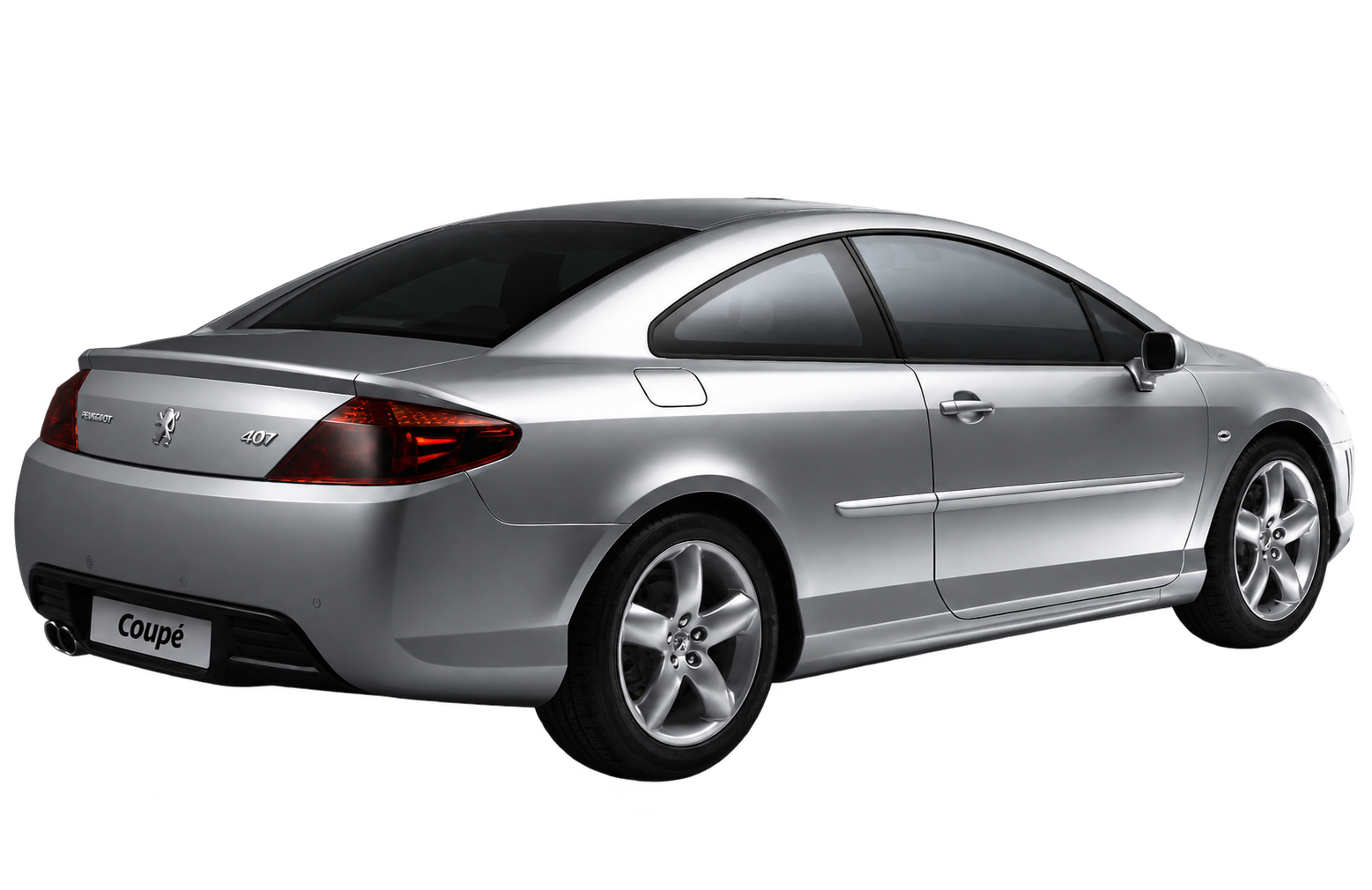 The silver Peugeot 407 coupé in a rear three-quarter view, isolated from its background.